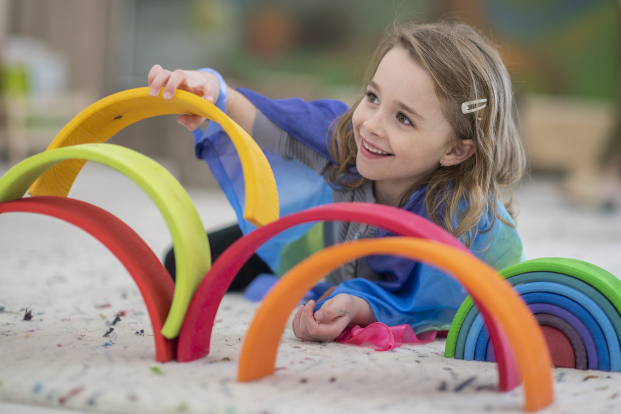 A little girl at a Montessori school; how to increase Montessori enrollment.