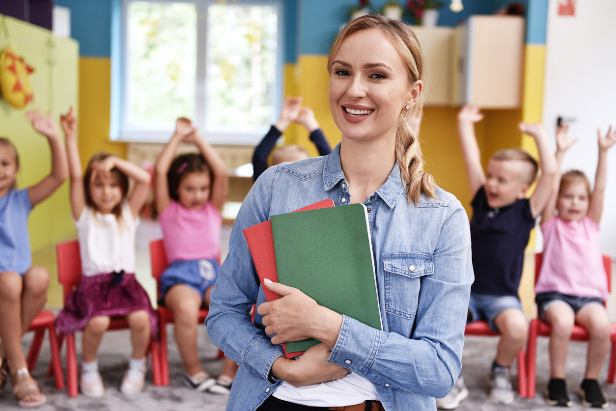 Smiling teacher in a daycare.